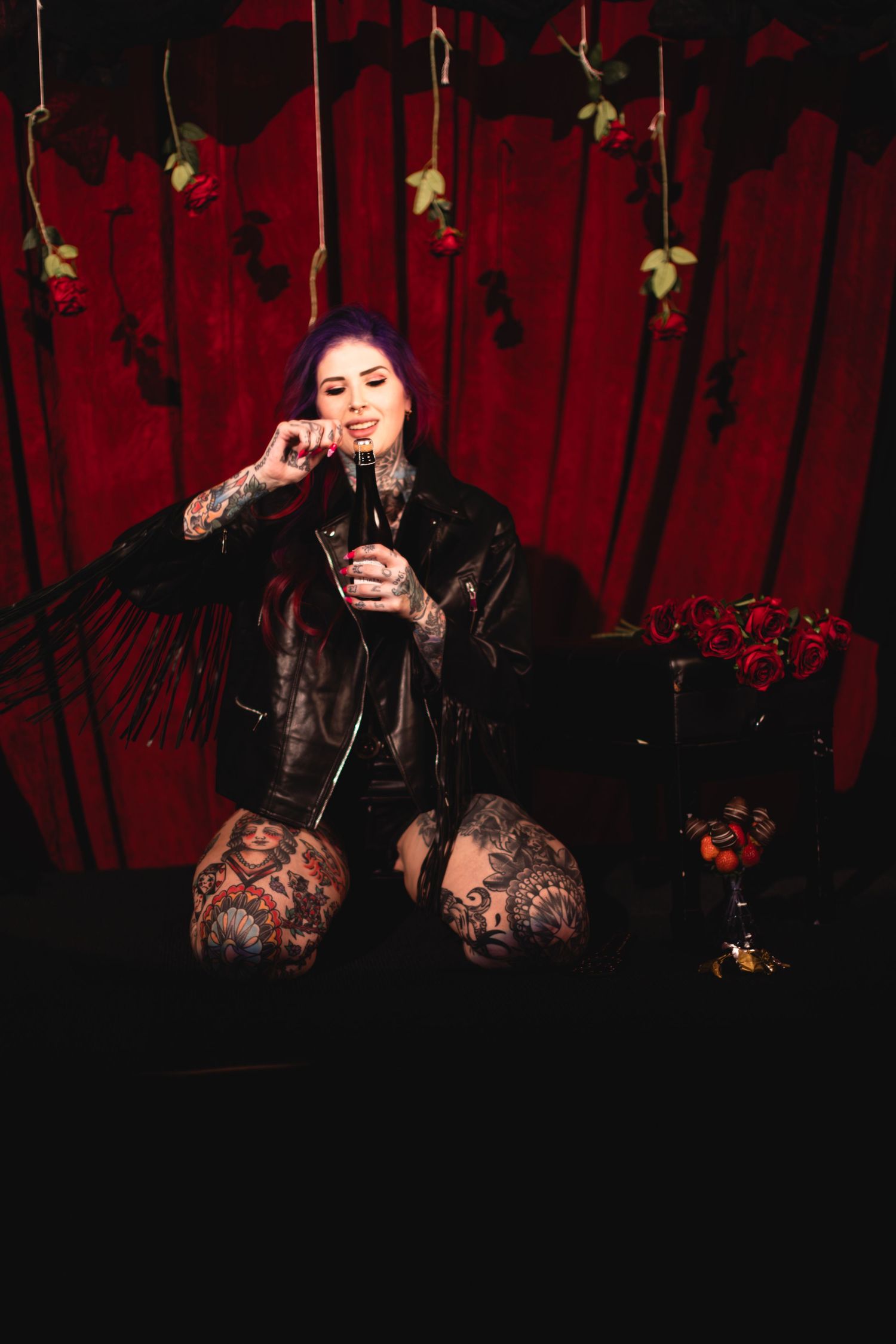Dramatic scene with red velvet curtains and dark atmospheric lighting.