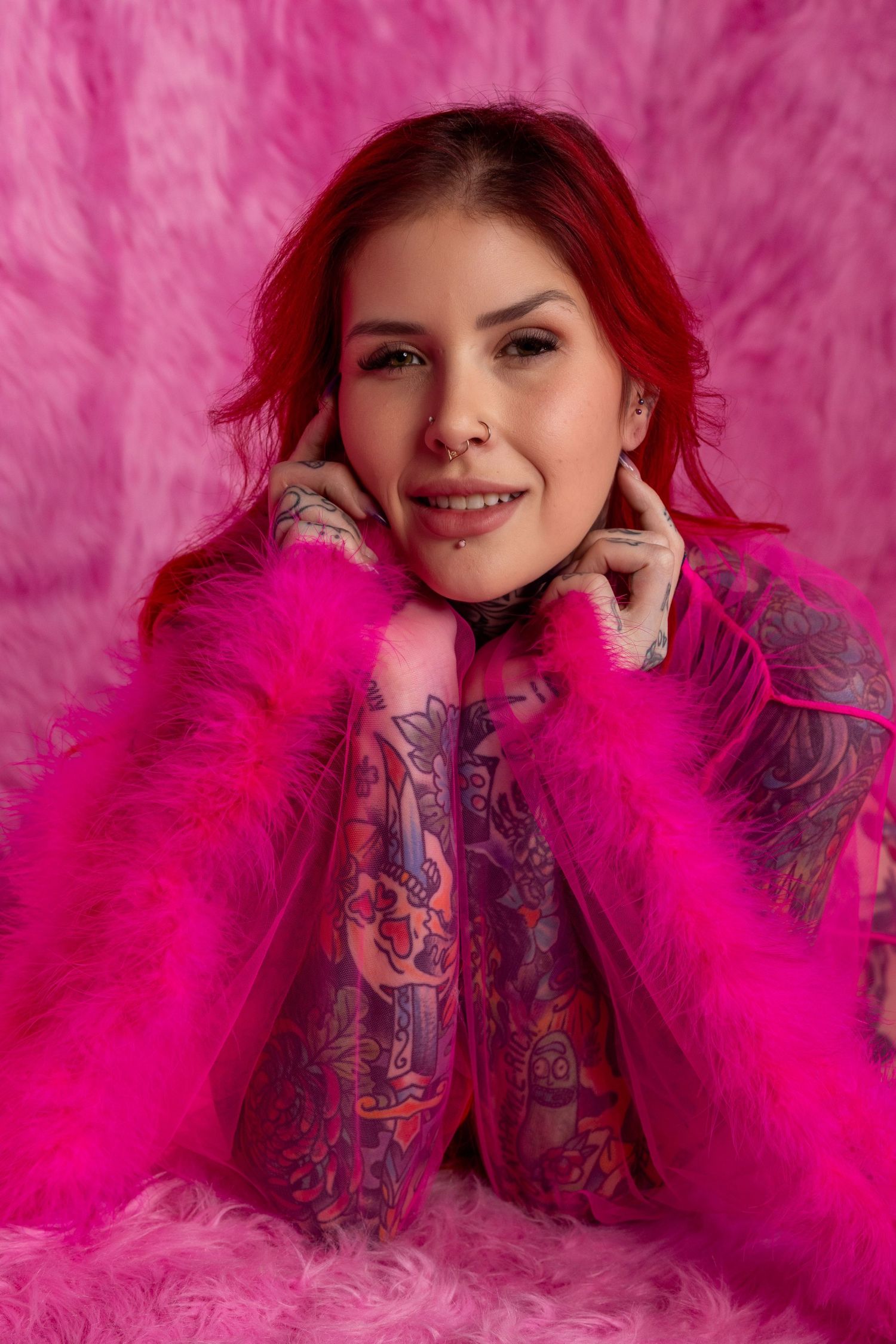 Set of lighthearted portrait shots against vibrant pink background with feather boa accessory and purple patterned clothing.
