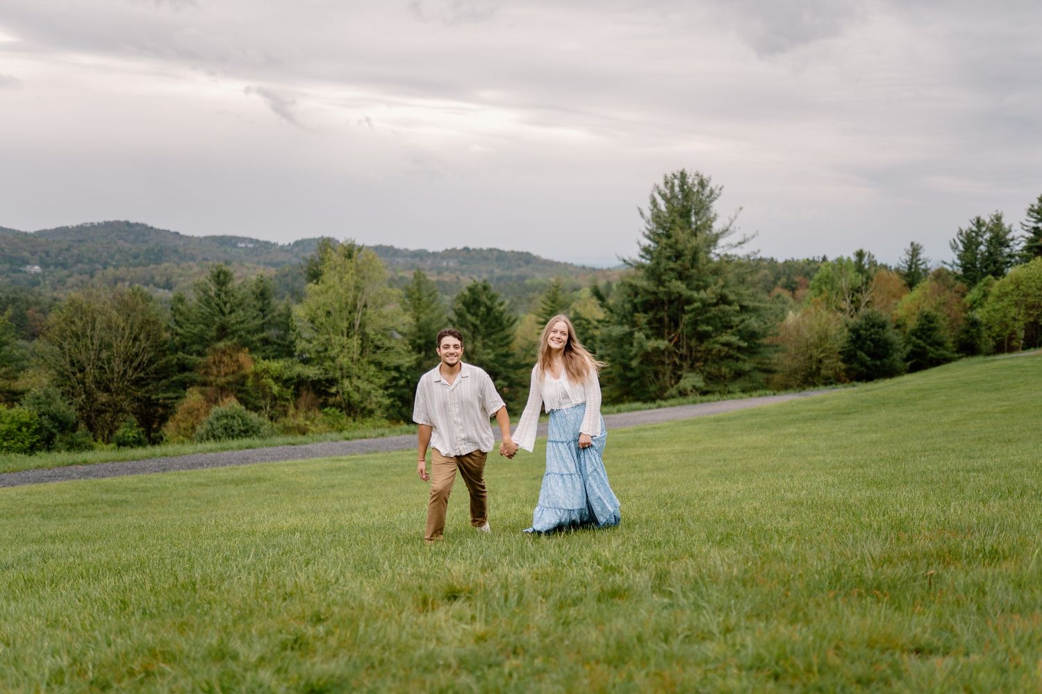 A queer couple in the woods in autumn making silly faces