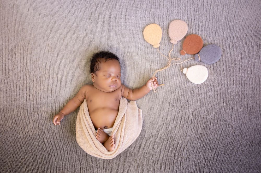 Newborn photography capturing tiny details, first moments, and precious memories in-studio or in-home sessions with care and creativity