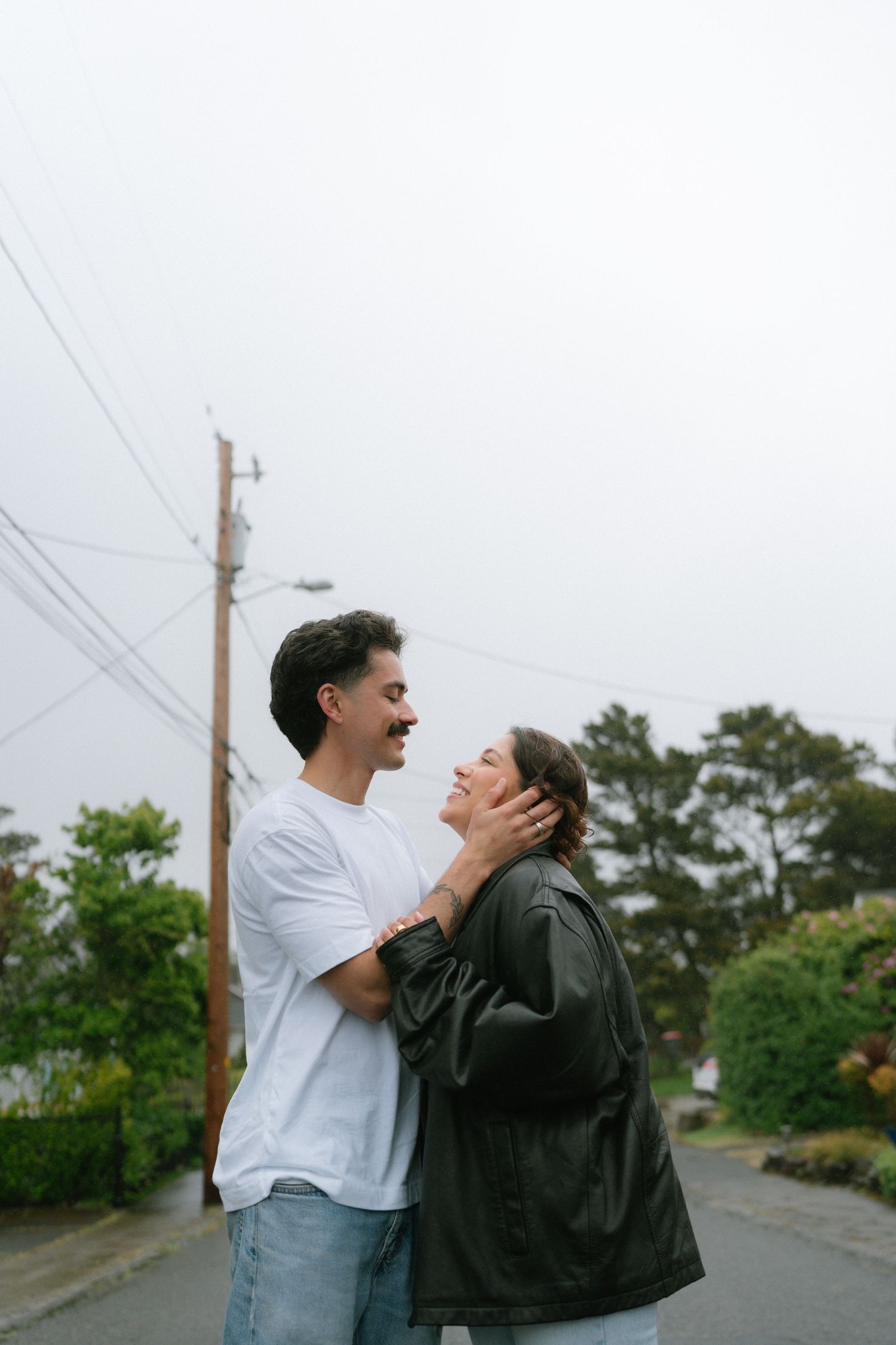 Two people in love, dancing in the rain,