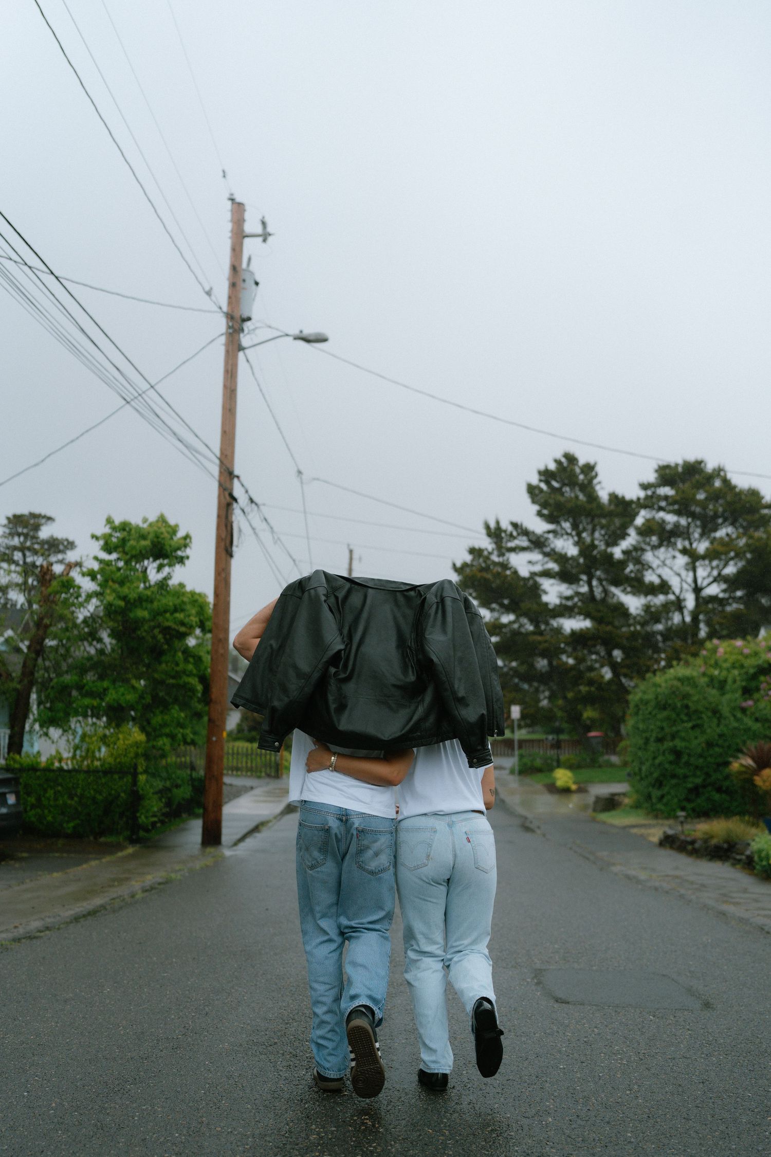 Two people in love, dancing in the rain,