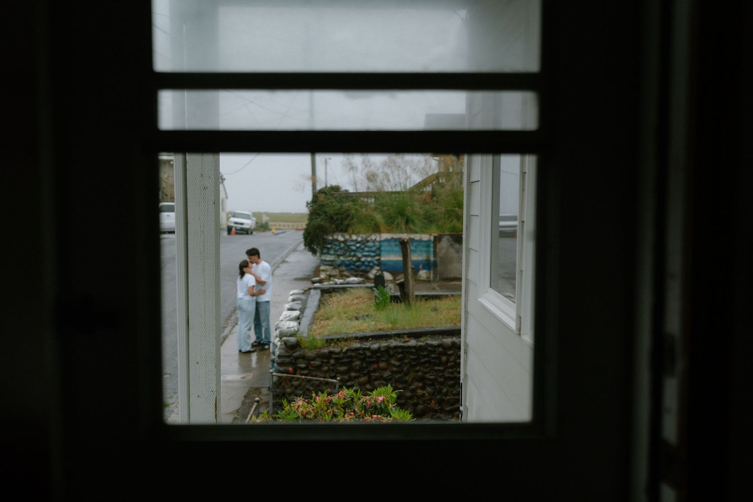 Two people in love, dancing in the rain,
