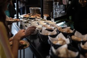 Assorted appetizers displayed on platters at a catering event.