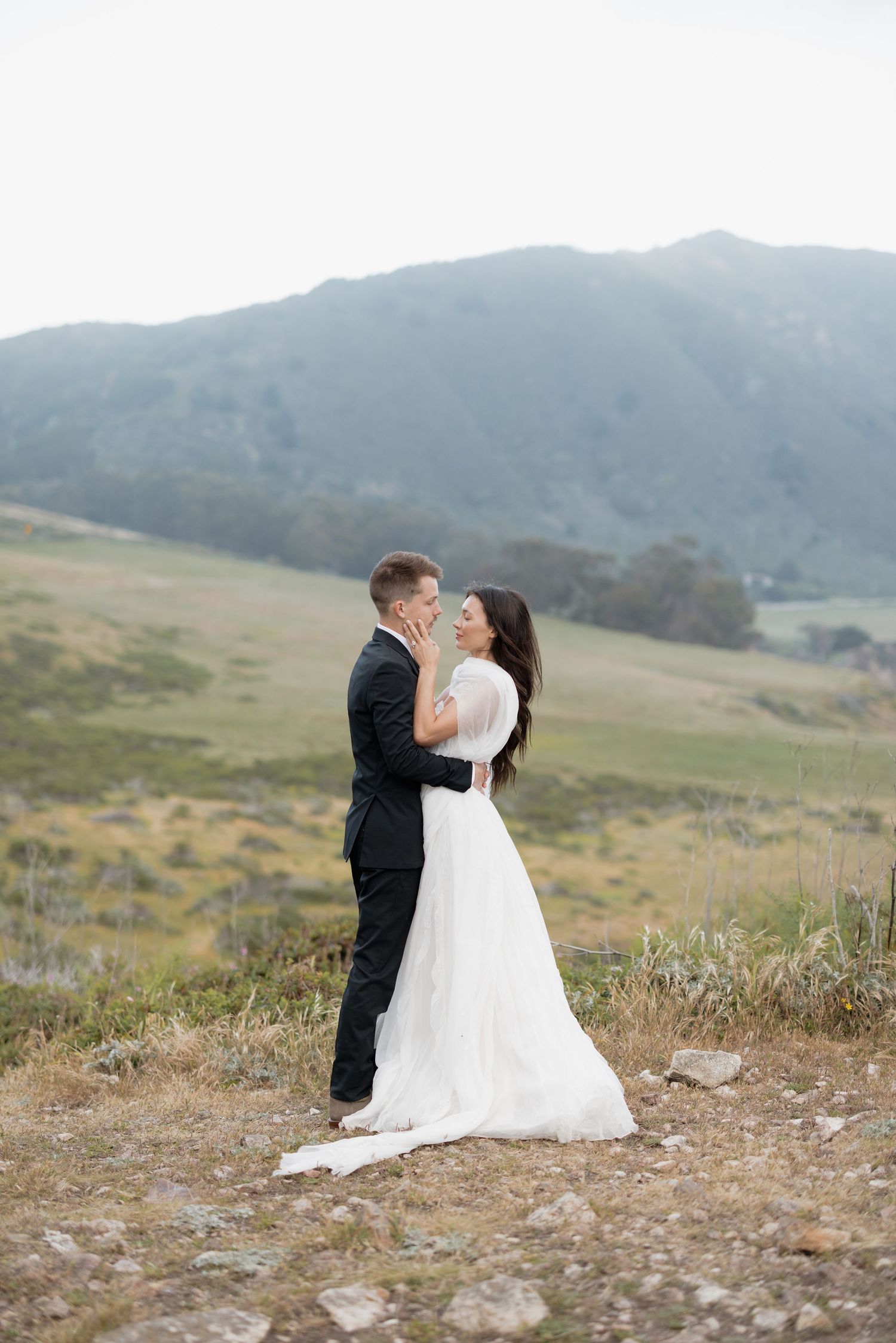 Timeless intimate moment of bride and groom after elopement in Ribera Beach in Carmel, CA