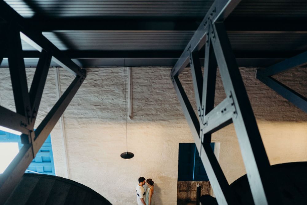 Emotional portrait of a couple during a destination engagement at the cellars, Quinta de Ventozelo, Douro Valley, Portugal.