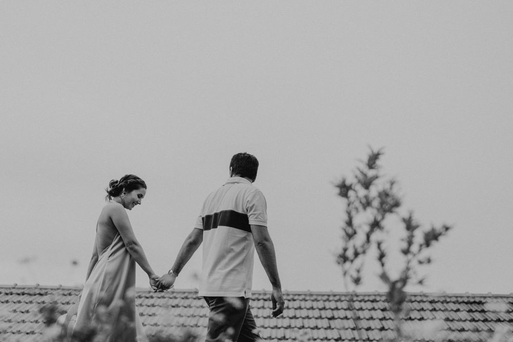 Couple laughing and exploring rustic stone paths in Quinta de Ventozelo, Douro wedding location