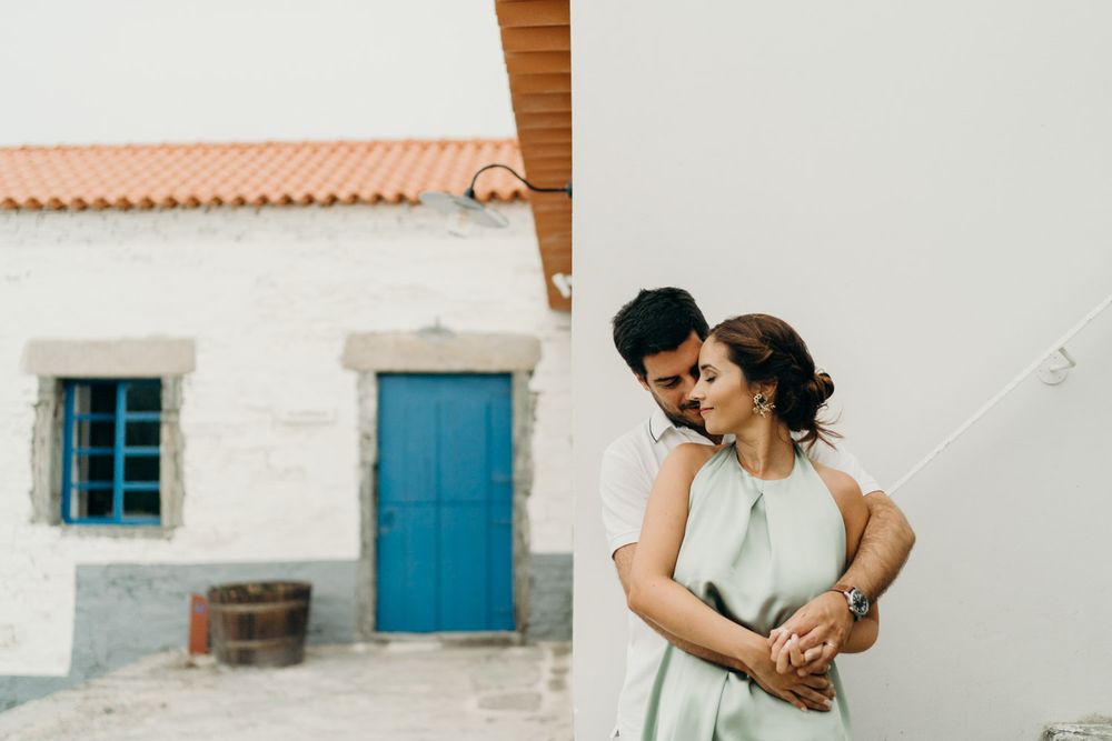 Couple laughing and exploring rustic stone paths in Quinta de Ventozelo, Douro wedding location