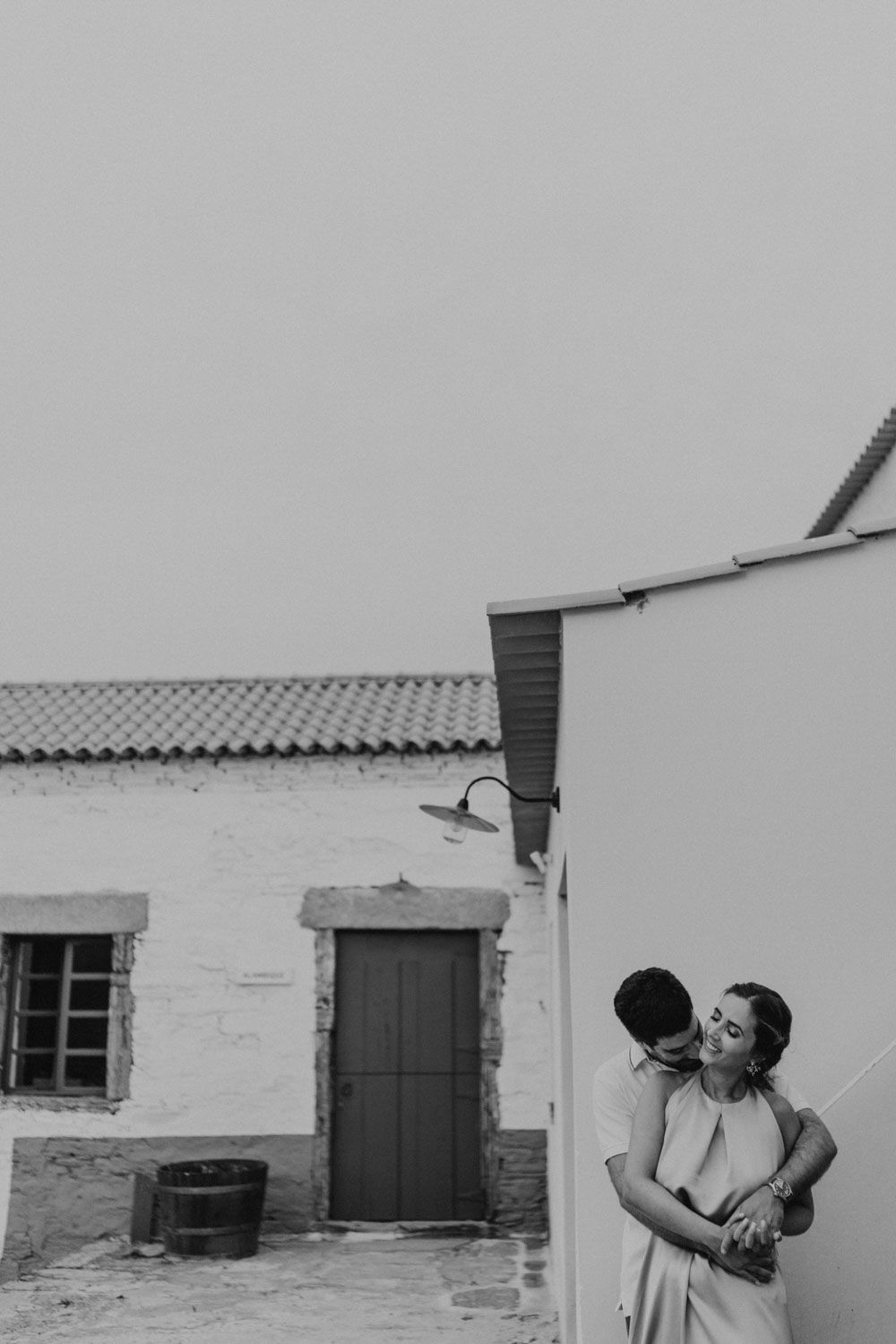 Couple laughing and exploring rustic stone paths in Quinta de Ventozelo, Douro wedding location