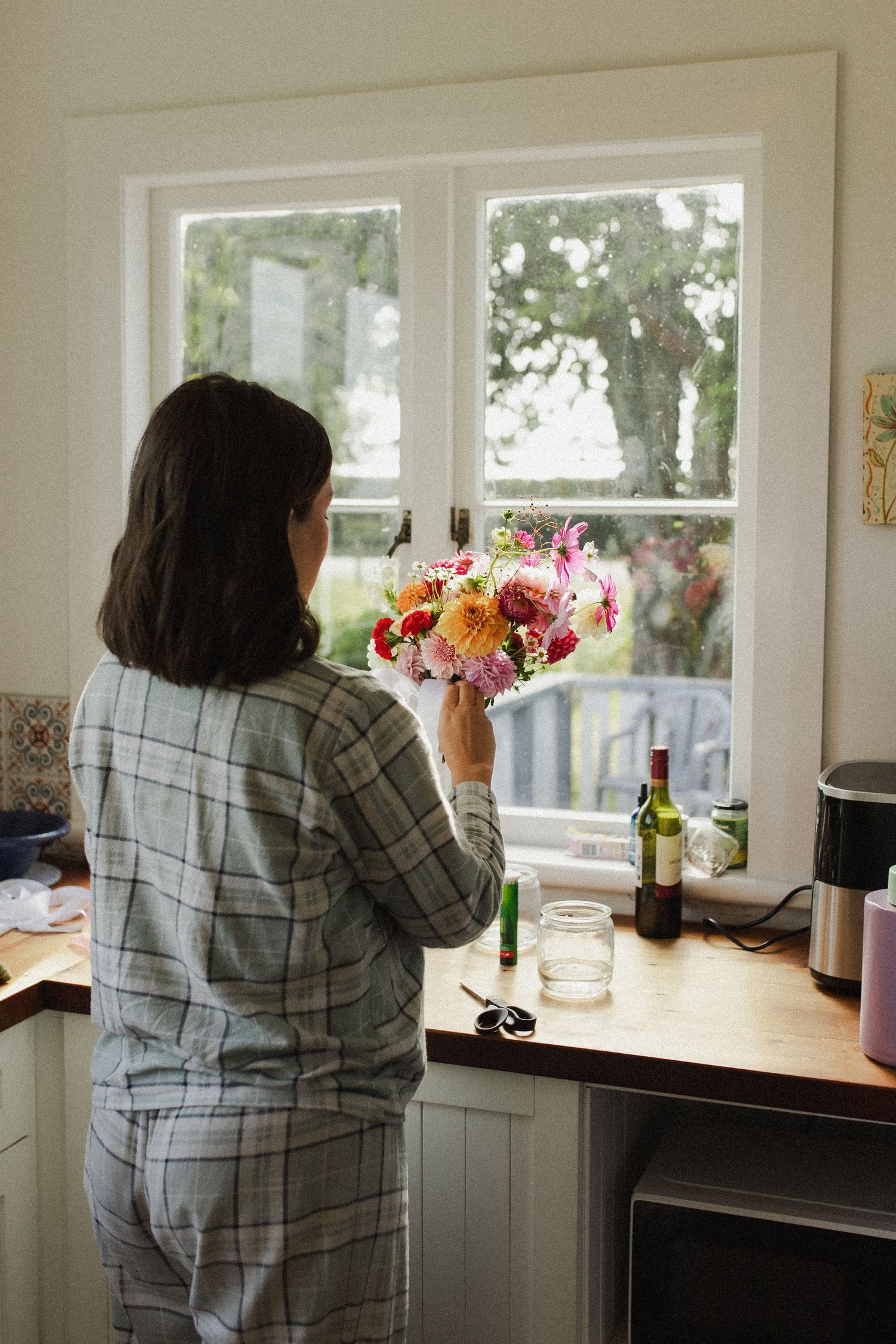 Bride preparing flowers for wedding at Eden Venue