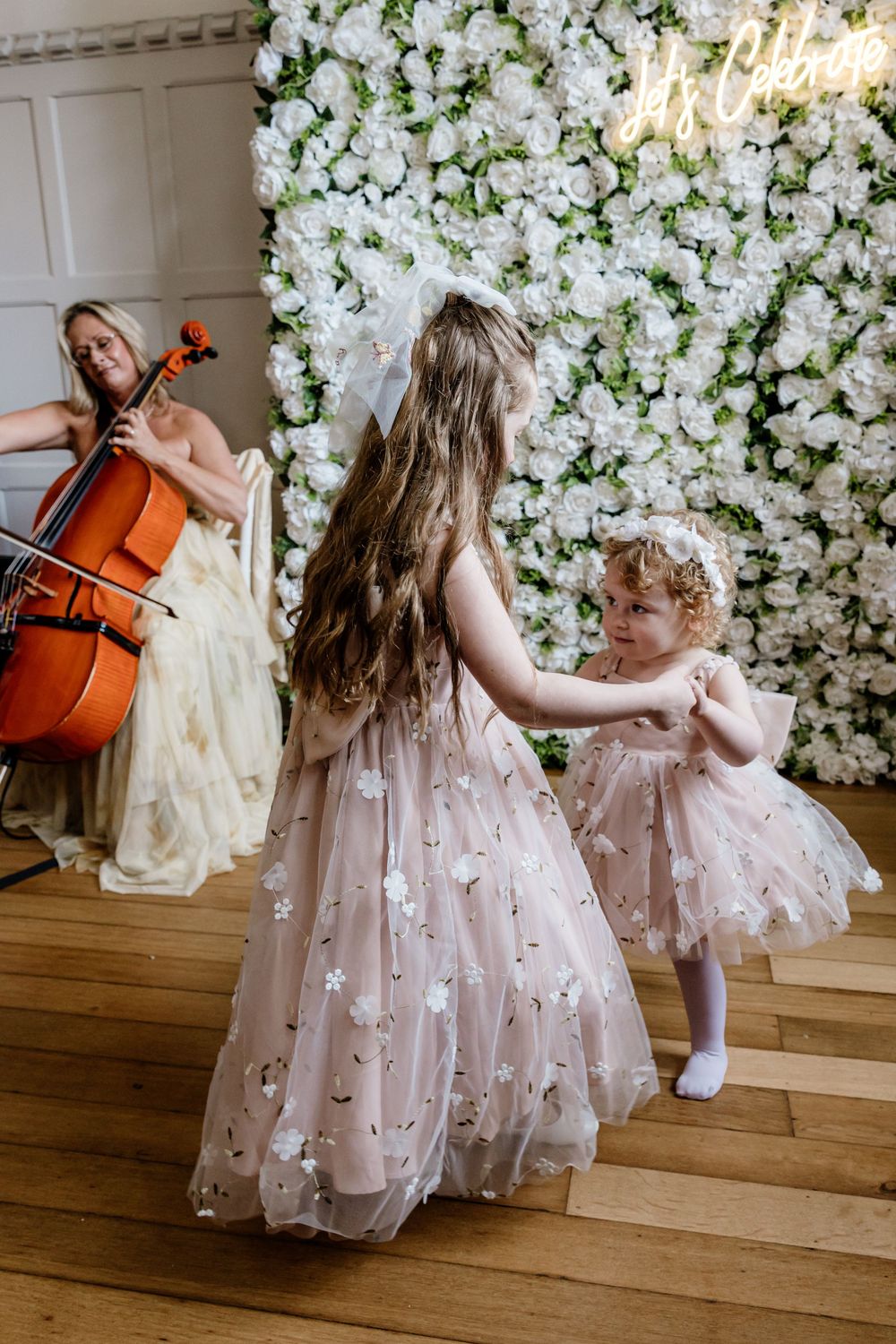 Flowergirls dancing to cello Highley Manor
