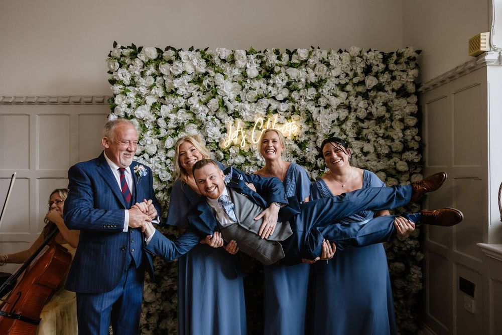 Groom being picked up by bridesmaids Highley Manor