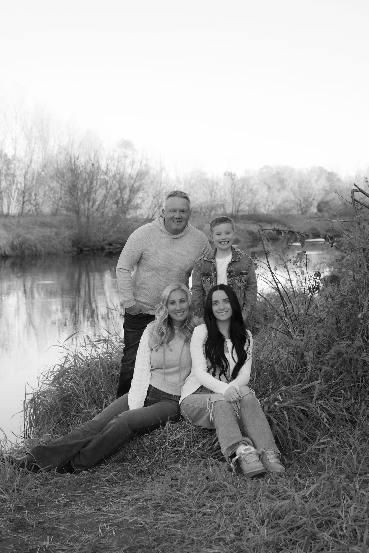 family portrait near the river during family photography session at willow river state park in hudson wisconsin