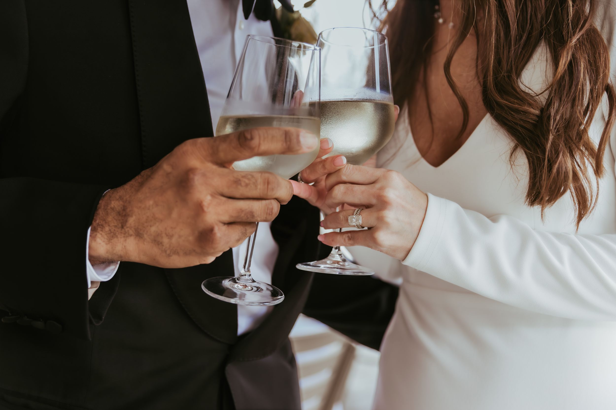 Bride and groom champagne toast for their wedding reception at Holliday Farms in Zionsville, Indiana