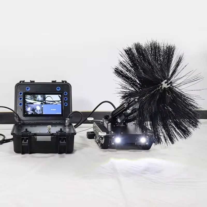 Robotic duct cleaning system with monitor case, camera unit, and rotating brush attachment for HVAC inspection.