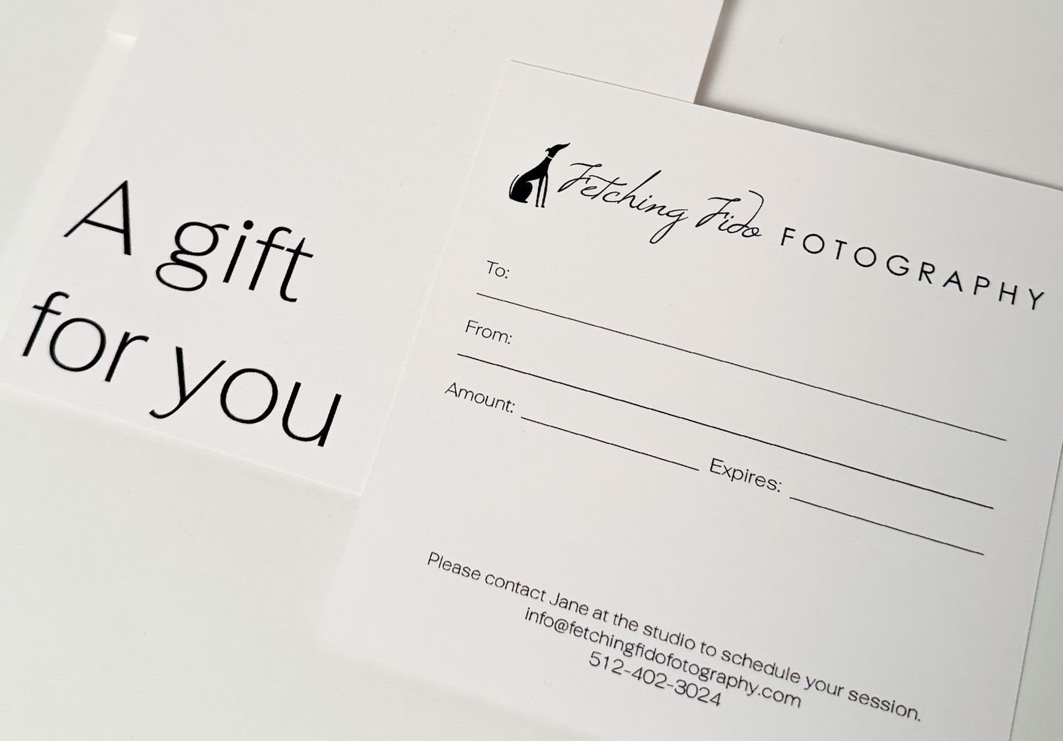 Fetching Fido Fotography gift certificate card with elegant black and white design, perfect for gifting a pet photo session.