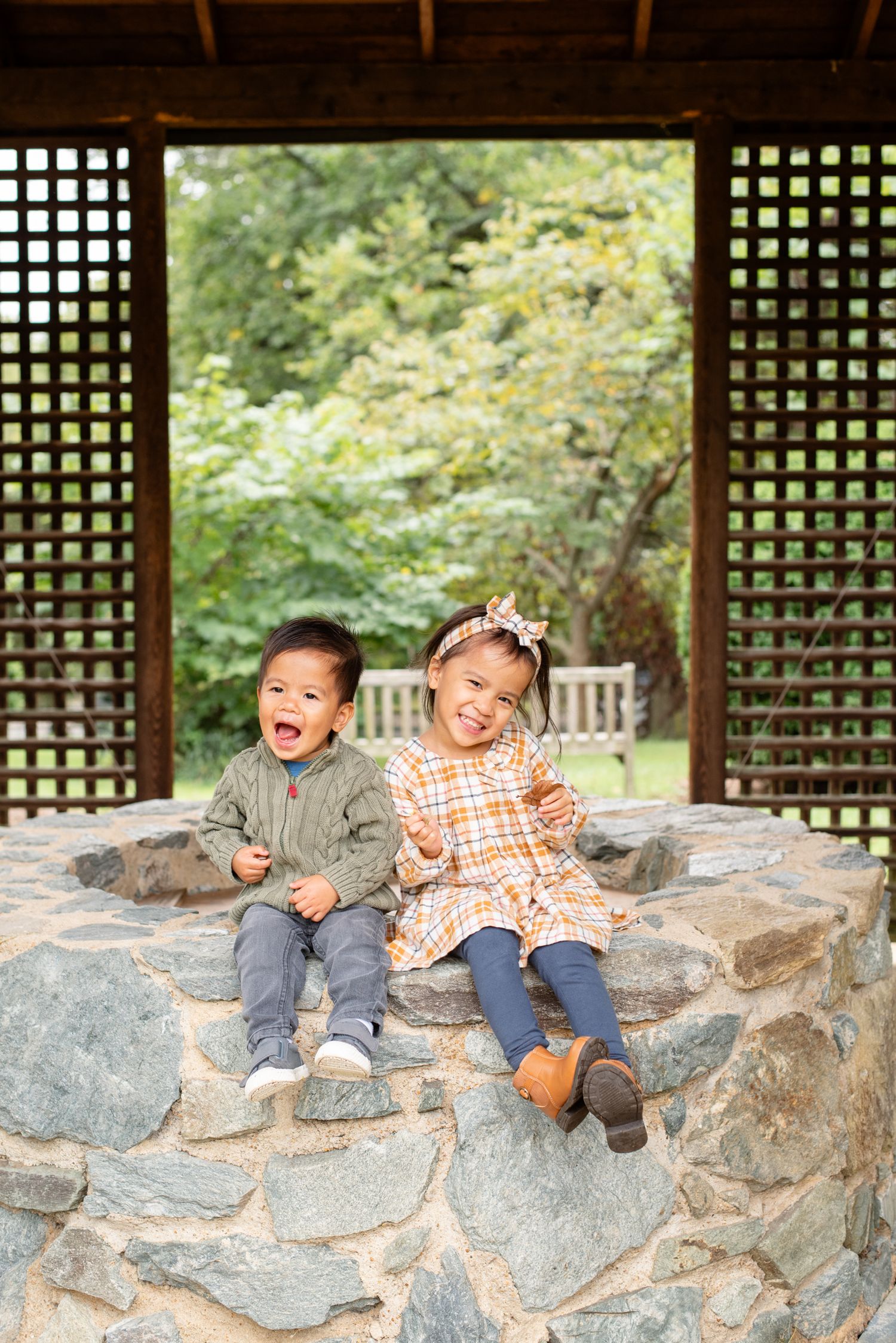 Candid sibling photo during family session in Northern Virginia by Sarah Thayer Photography. First year I photographed this family