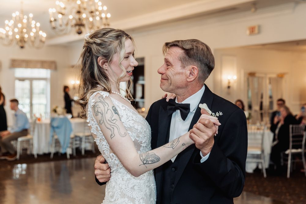 Bride and groom share their first dance at elegant wedding reception.