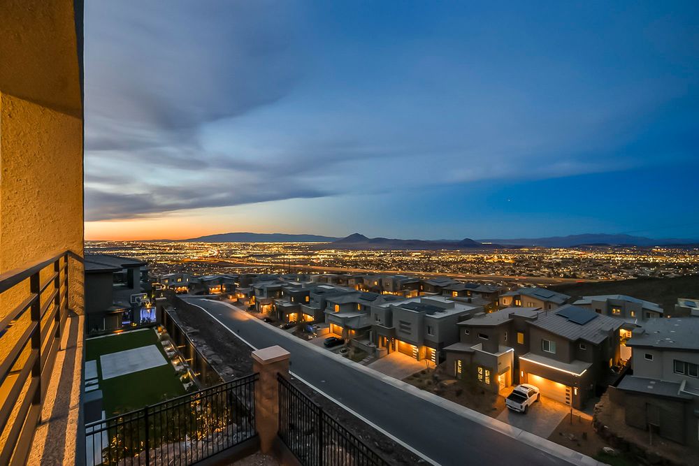 Breathtaking twilight view of Las Vegas valley from a luxury home balcony at sunset.