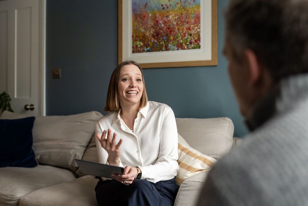 In-person client consultation on a sofa during a personal branding photo shoot