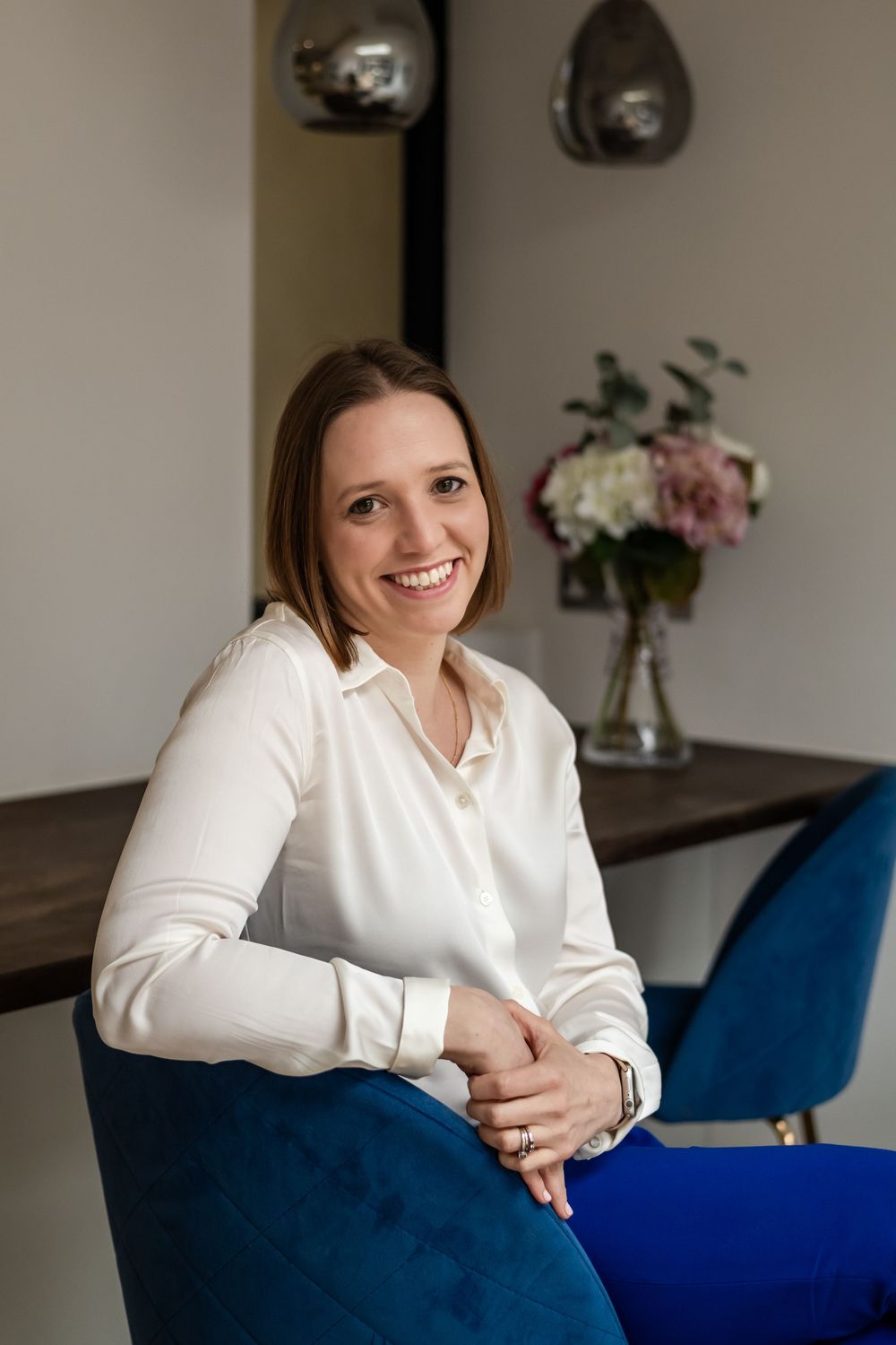 Professional headshot of a smiling psychologist captured during a personal branding photoshoot