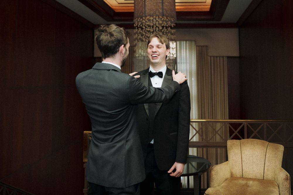 Tiffany and Sam getting ready at the Santos Hotel in Toronto before their Hart House wedding.
