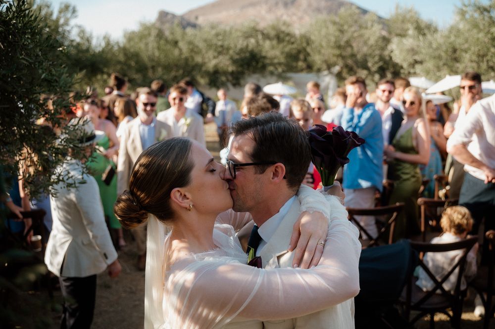 A documentary photo of a bride and groom after their wedding ceremony in Chania, Crete