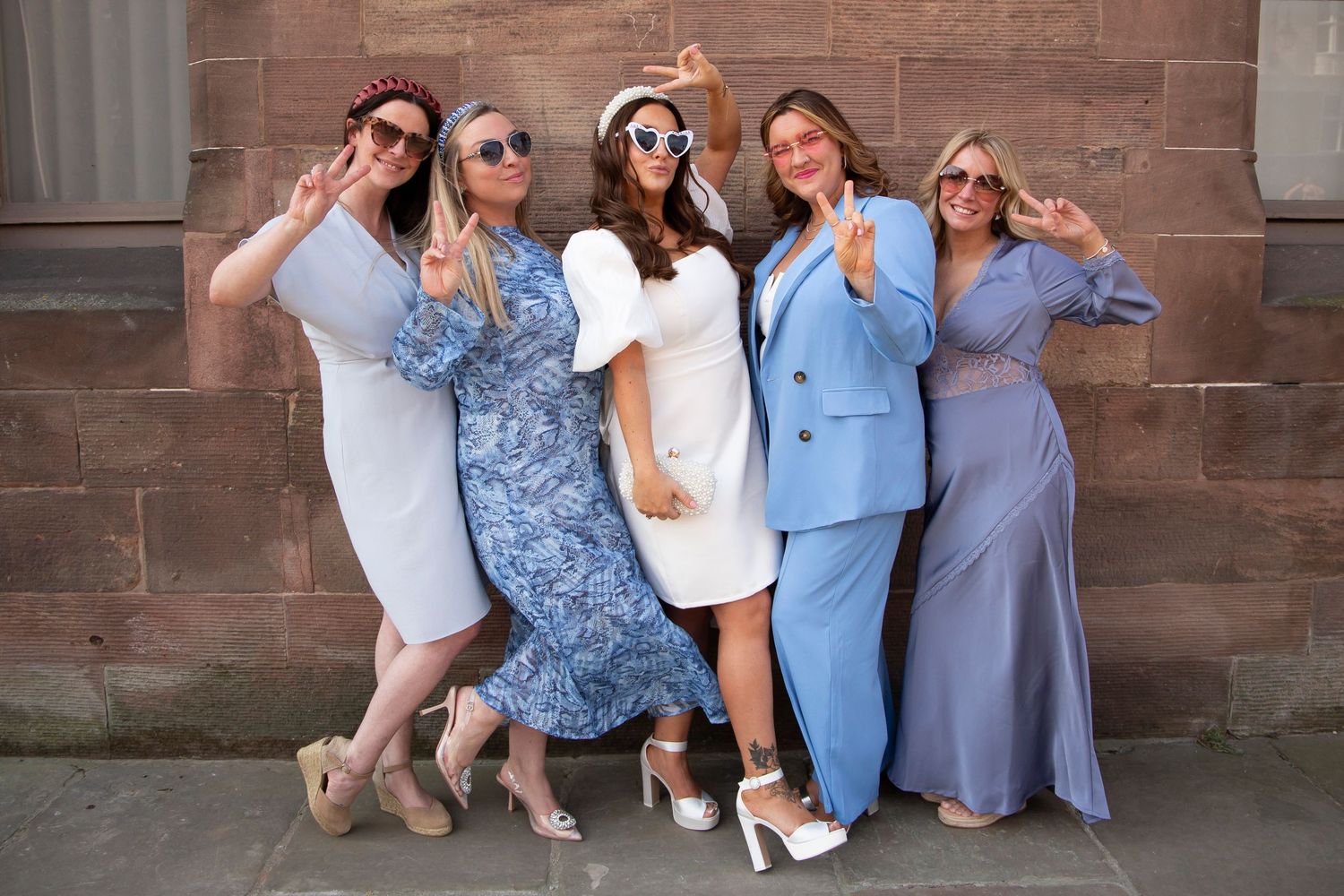 Bride with friends dressed as her good luck something blue bridesmaids at Chester Town Hall wedding