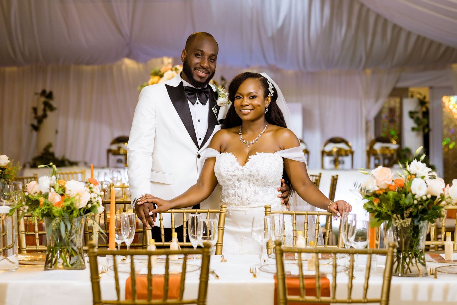 Intimate wedding portrait featuring luxury details and formal attire.