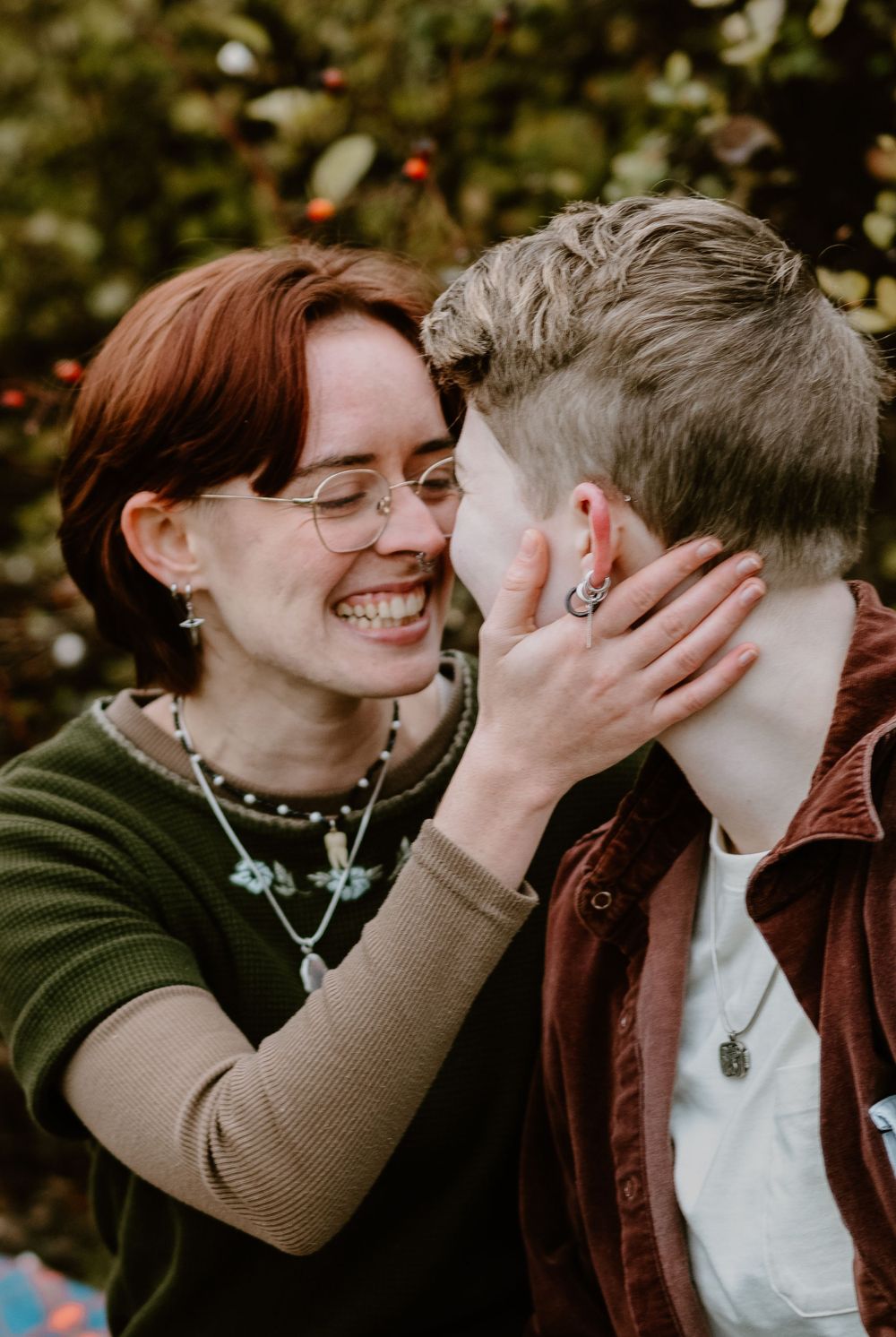 Candid moment of joy and affection between two people outdoors.