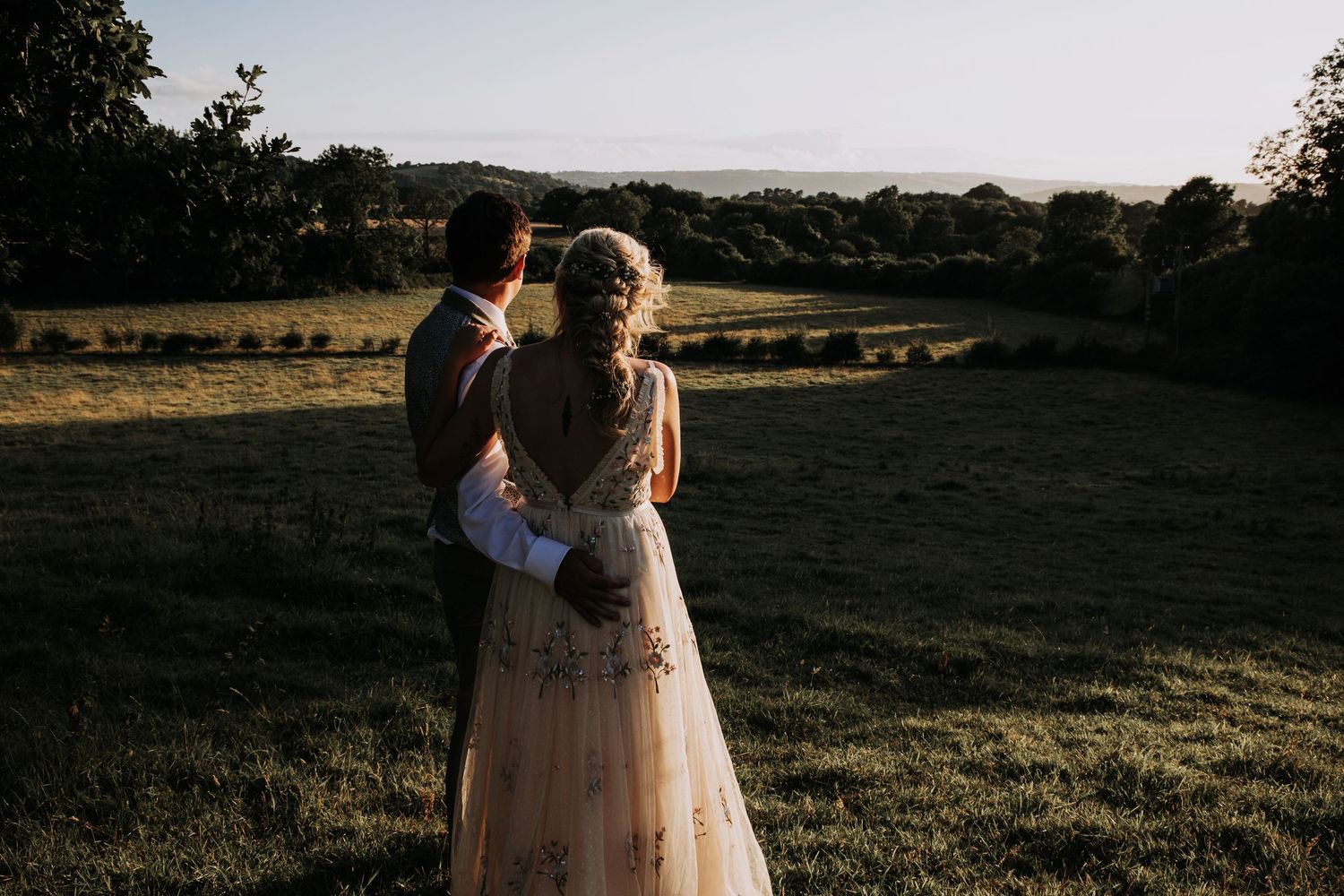 A couple staring into the distance in Folly Farm Centre, Somerset
