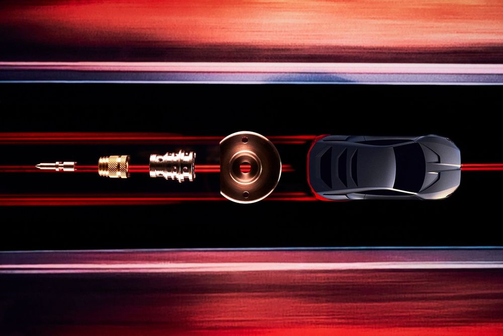 Abstract red and black streaks of light create dynamic motion trails against a dark background.