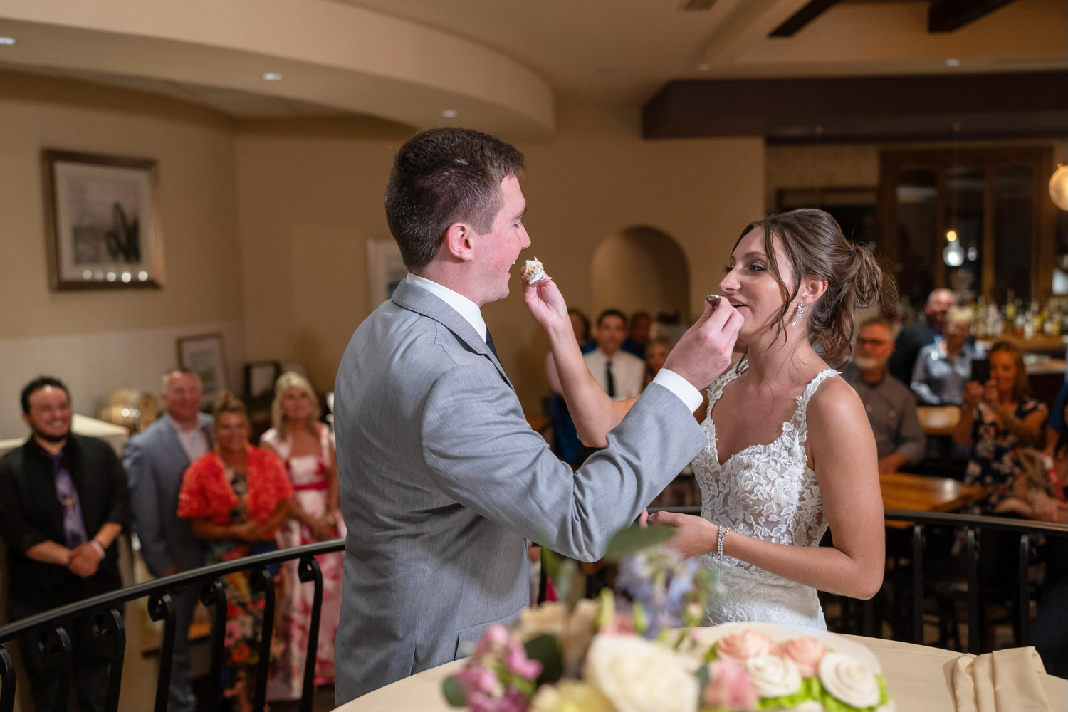 A couple cut cake at the club at corazon wedding photos