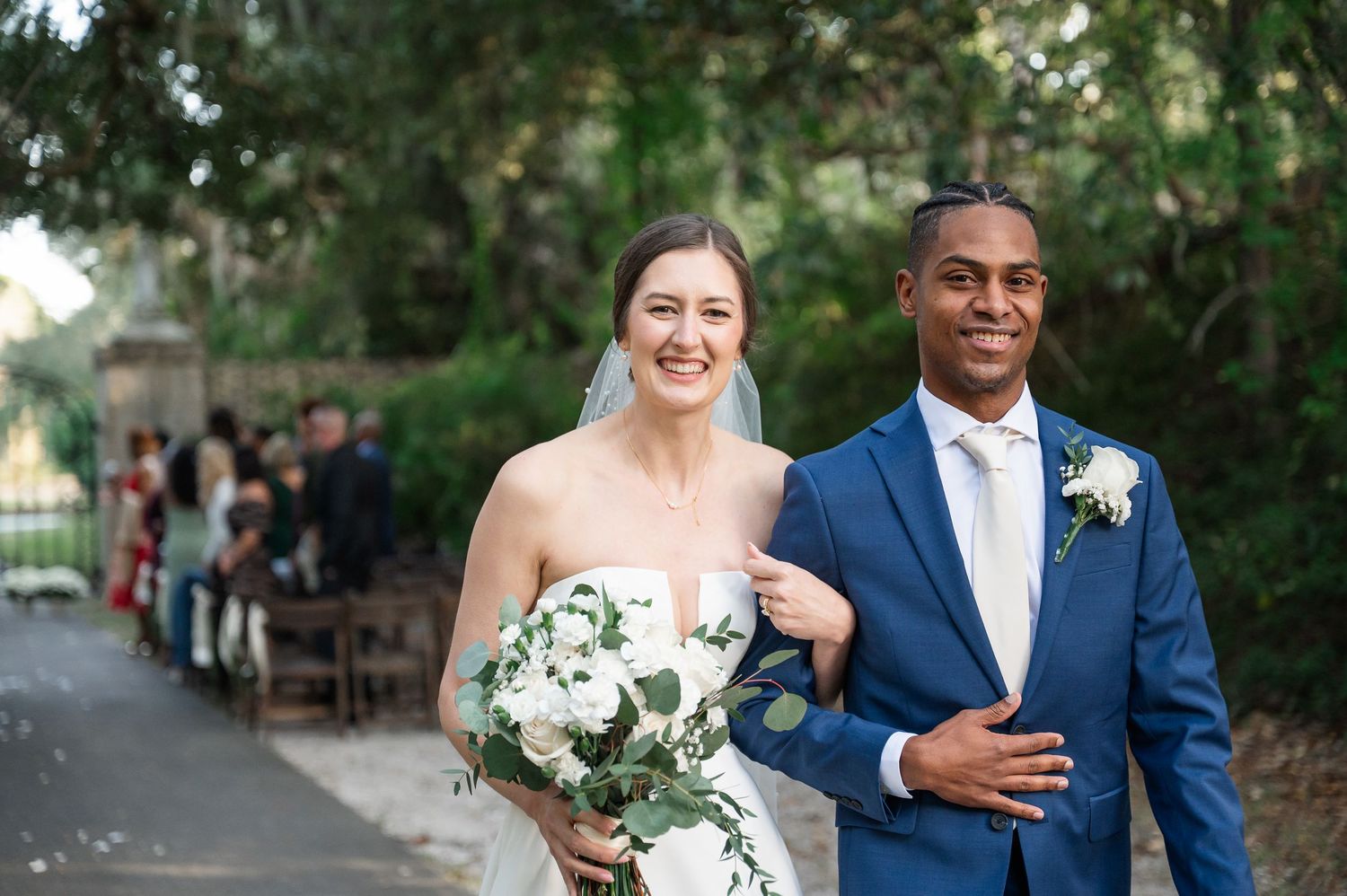 Bride and groom walking away from ceremony