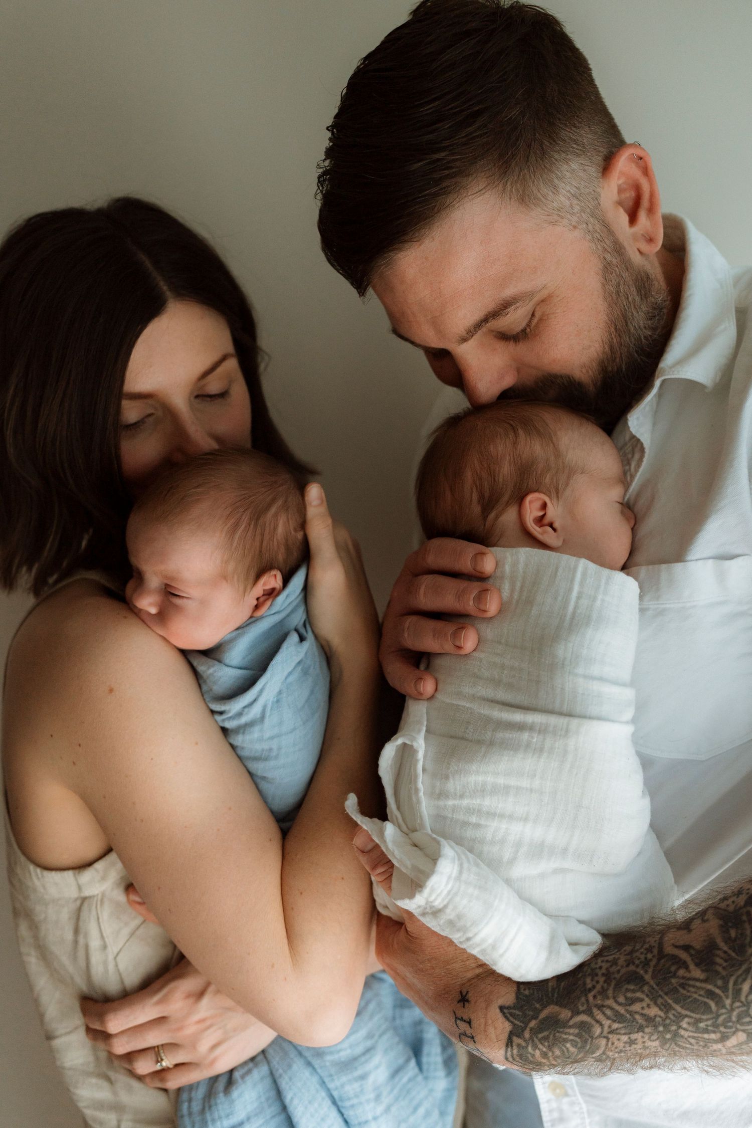 A tender series of natural light photos showing intimate moments between a parent and baby in gentle lighting.