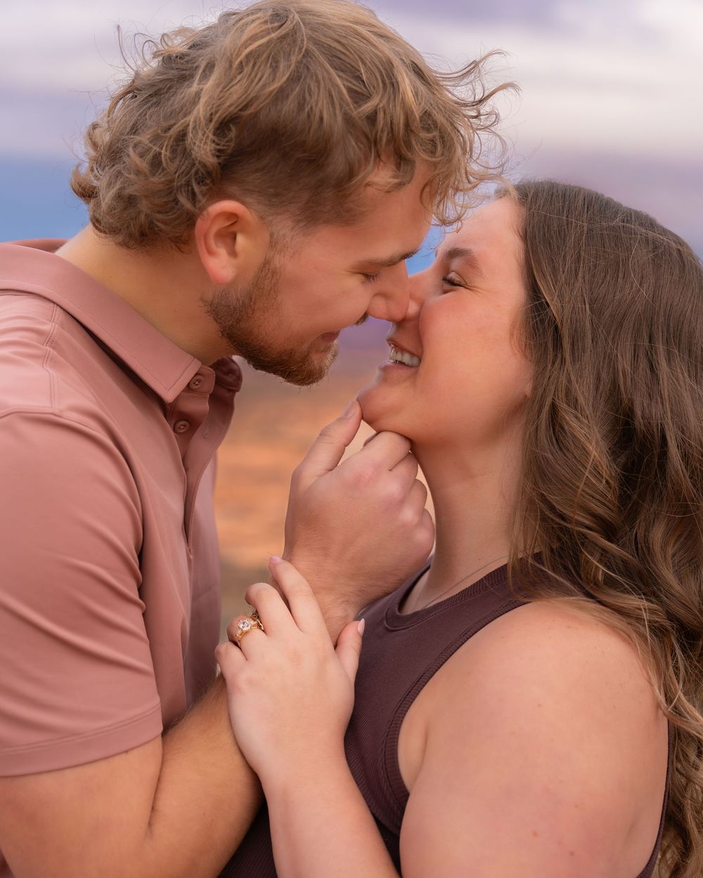Tender romantic moment captured during sunset in the desert.
