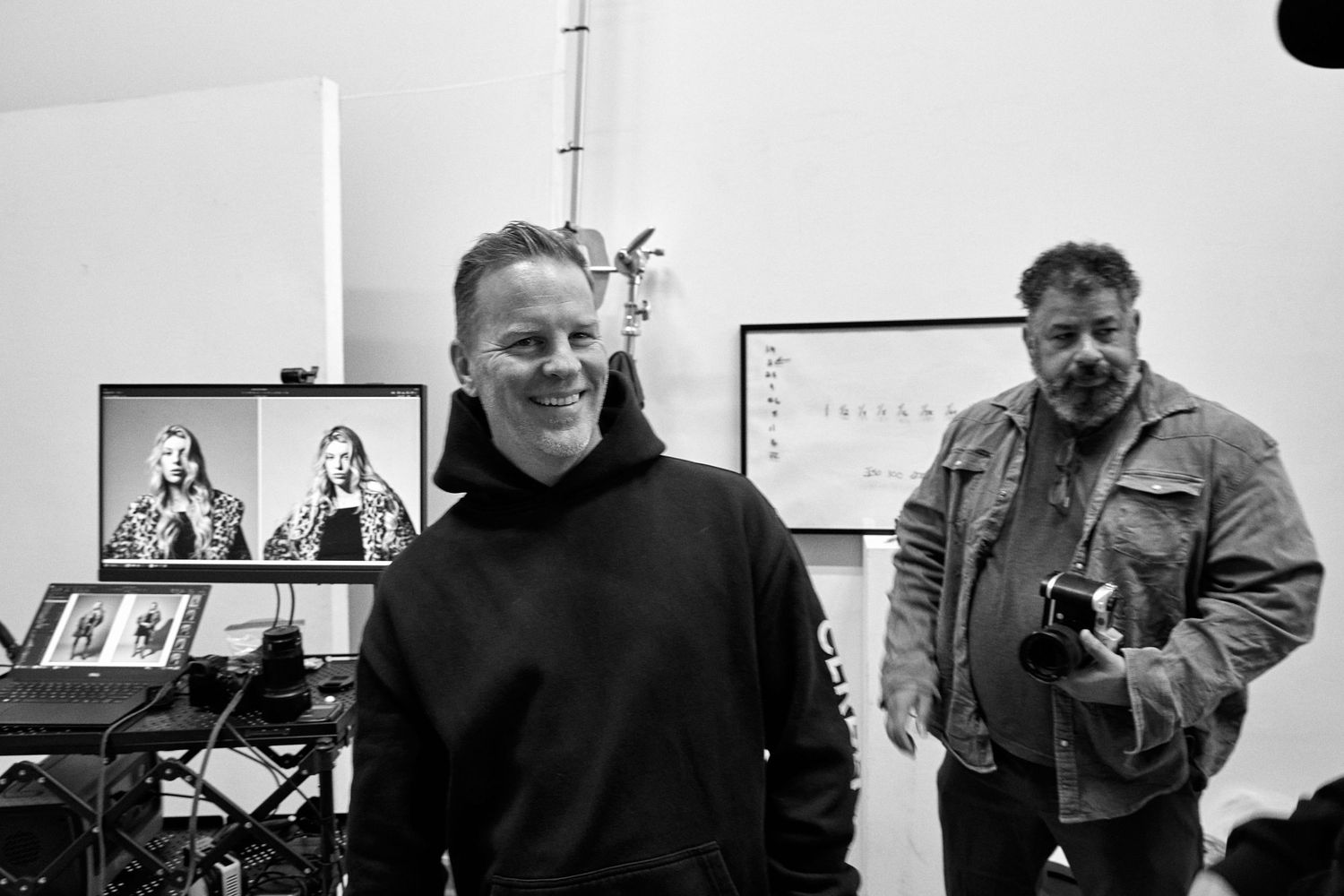 Musicians in a recording studio collaborate while working on music production.