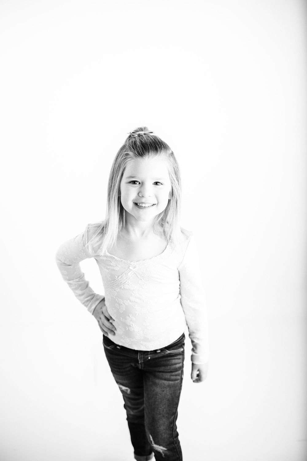 A series of black and white portraits showing a person in casual attire against a white background.