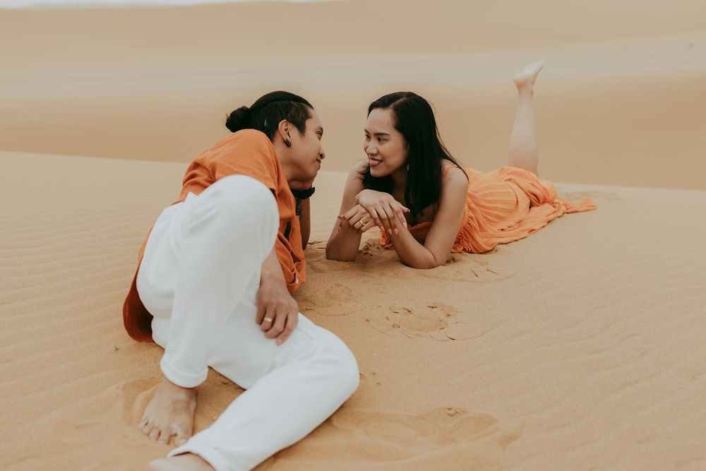 Romantic couple at golden dunes in Swakopmund at sunset