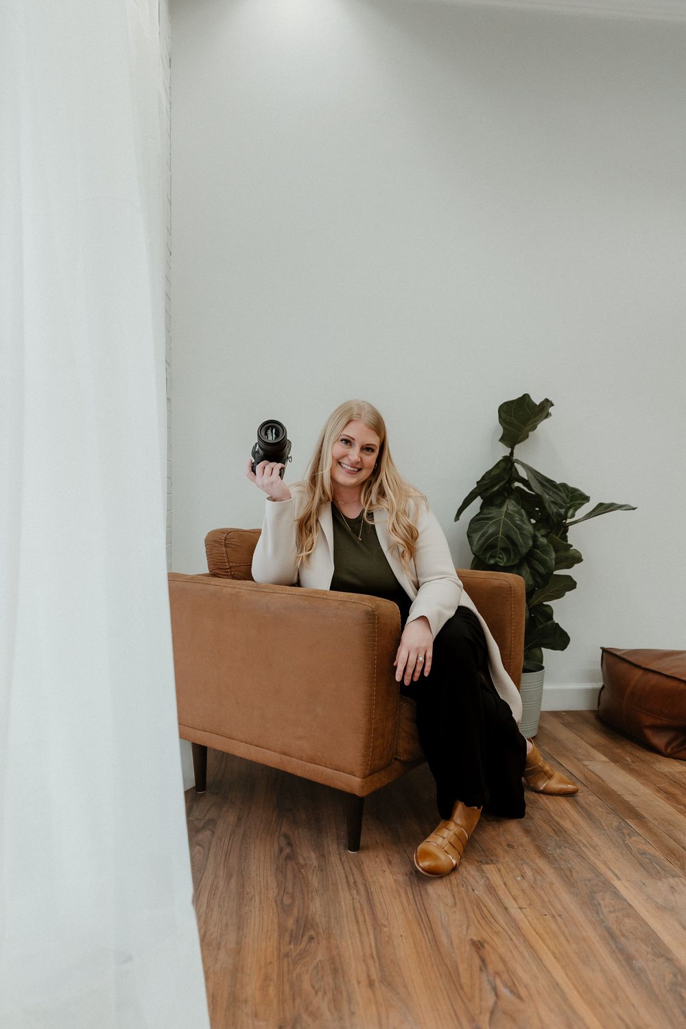 A series of photos showing a person lounging on a brown leather couch in a bright minimalist room with wooden floors.