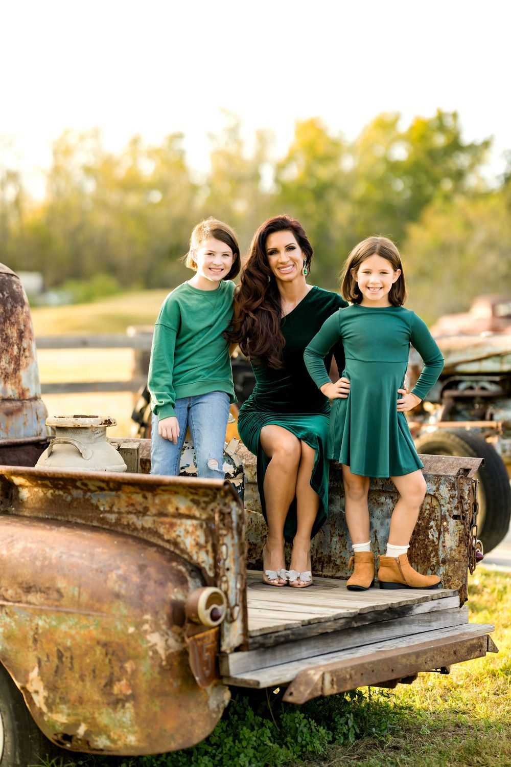 A rustic photo series showing people sitting on an old vintage truck bed at sunset in matching green outfits.