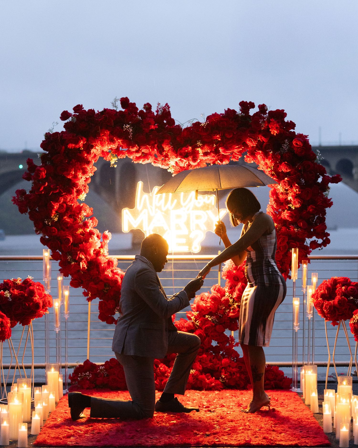 A romantic proposal sequence taking place on outdoor steps of a historic building.