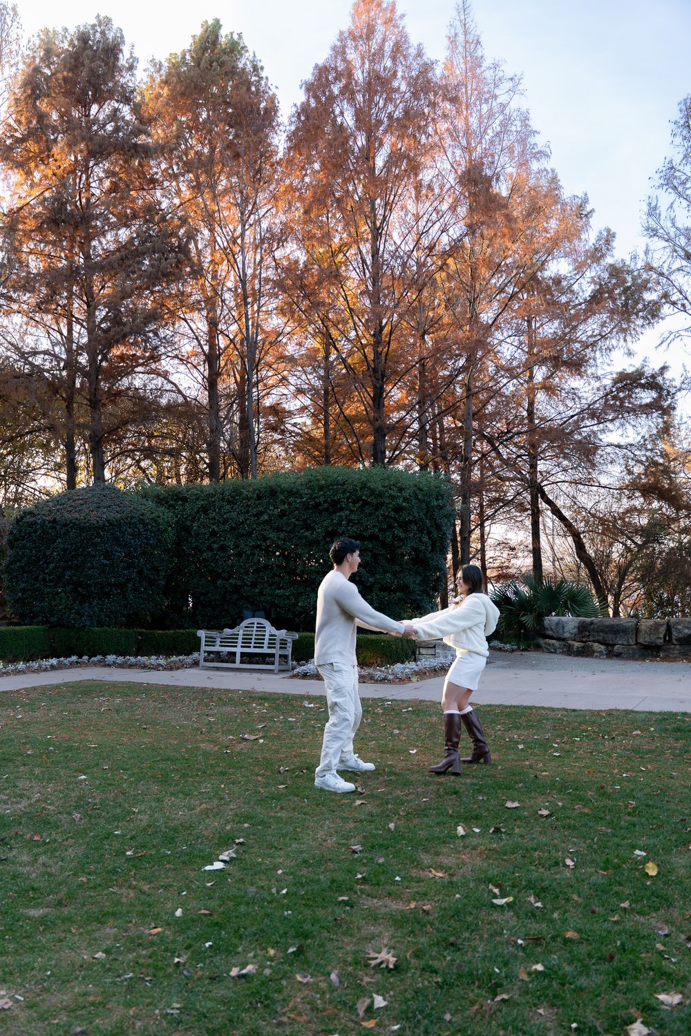 Luxury engagement proposal at Dallas Arboretum with couple smiling and hugging