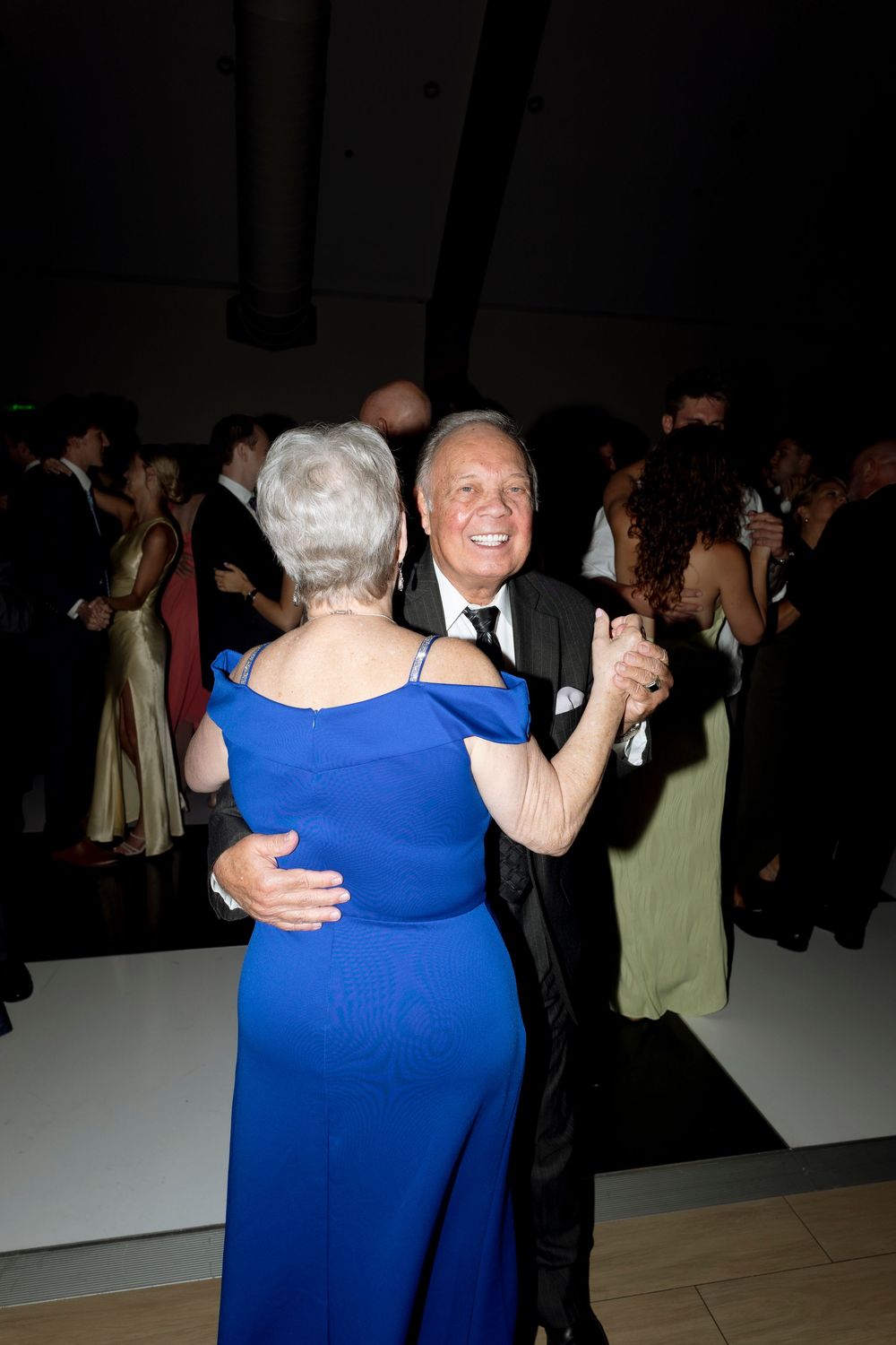 A sequence of dance photos showing couples embracing and dancing together at a formal event.