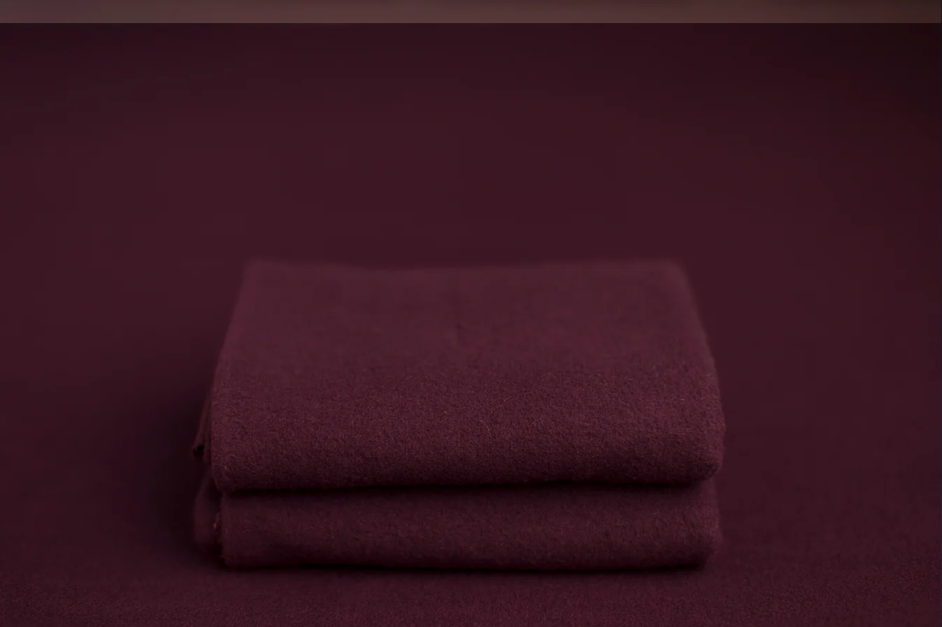 Dark berry purple newborn wrap sample for baby photography.