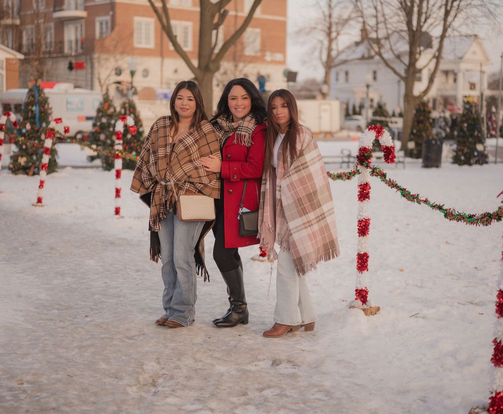 Four winter photos show people walking in snow with red lanterns and Christmas decorations creating a festive atmosphere.