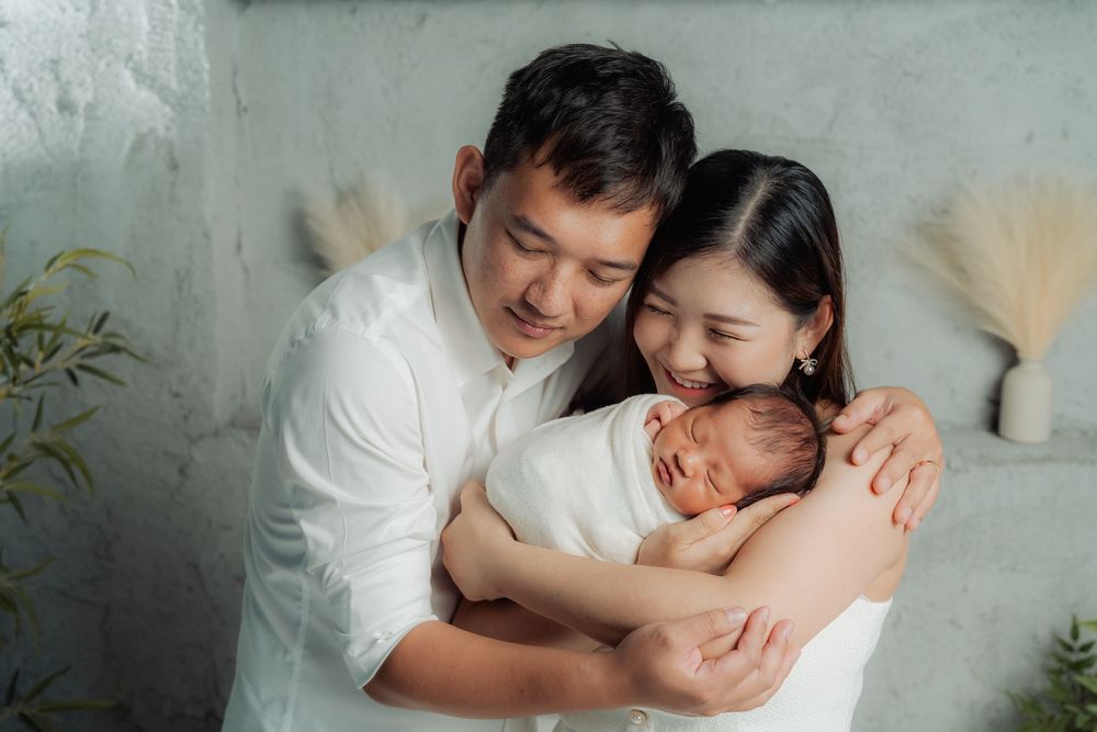 Light and airy family portrait series with soft neutral tones and natural poses.