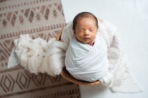 Minimalist newborn photography series on white background with geometric pattern details.