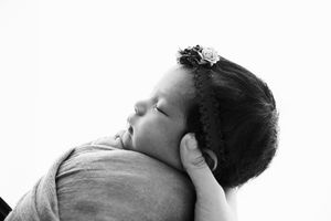 High contrast black and white artistic newborn photography series.