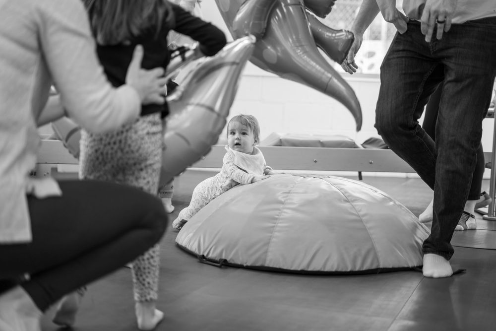 A black and white collage of people performing various dance moves on a dance floor.